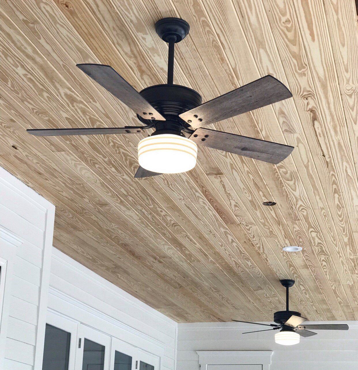 Cedar Key adds powerful air to a Coastal Farmhouse porch